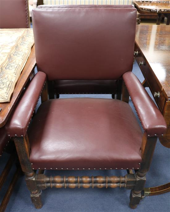 A set of seven 17th century style oak and leather dining chairs, including a pair of carvers